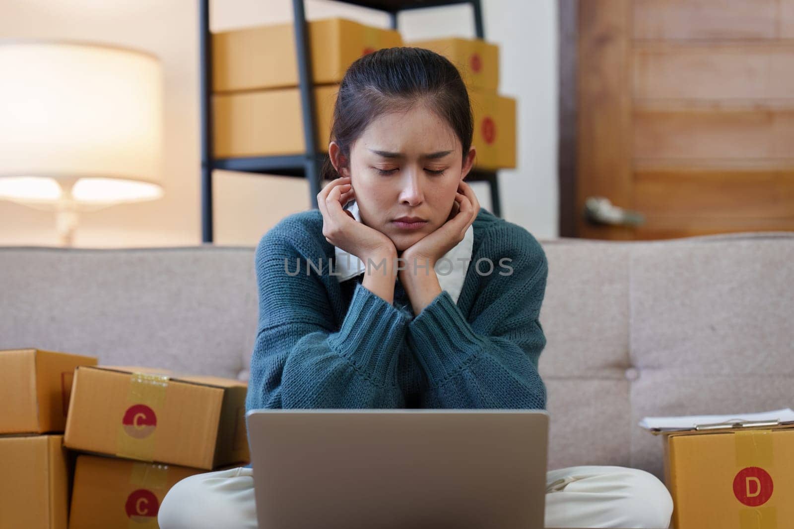 Small businesses SME owners female entrepreneurs stress while check online orders to prepare to pack the boxes, sell to customers, sme business ideas online.