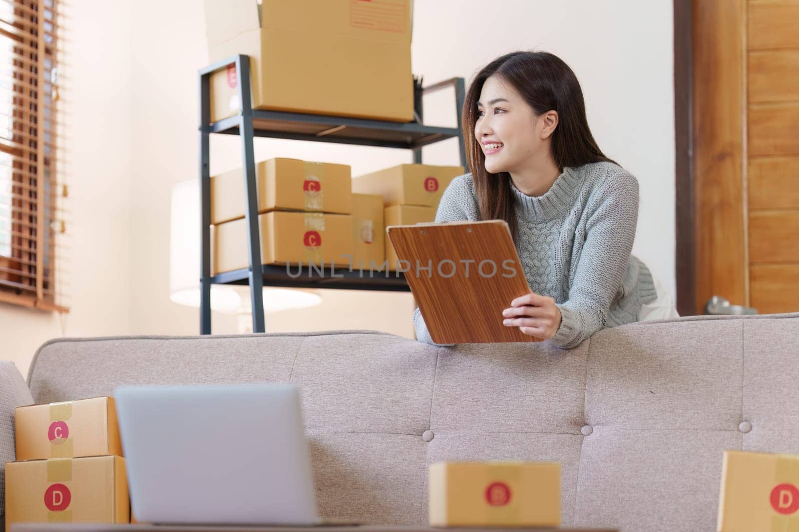 Small businesses SME owners female entrepreneurs check online orders to prepare to pack the boxes, sell to customers, sme business ideas online.