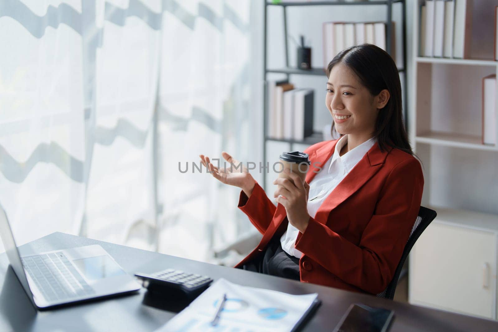 Beautiful young teen asian business woman meeting at on computer laptop with planning working on financial document, tax, exchange, accounting and Financial advisor.