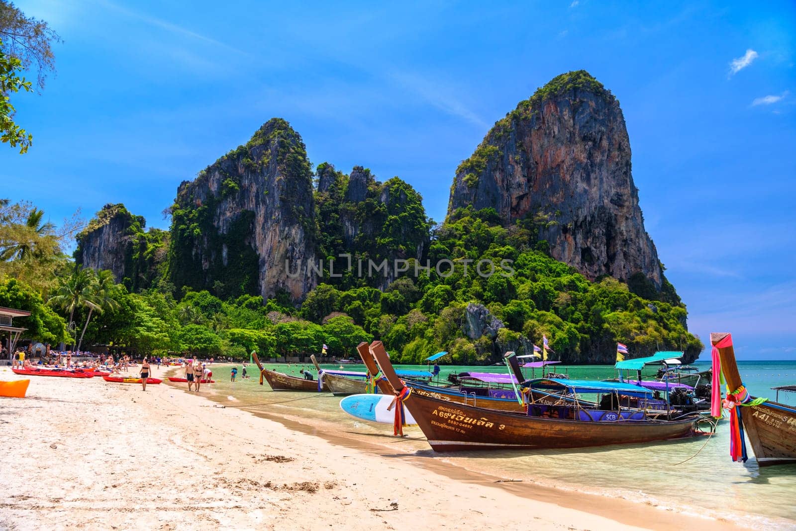 KRABI, THAILAND- MARCH 2018: Long tail boats and rocks on Railay beach west, Ao Nang, Krabi, Thailand by Eagle2308