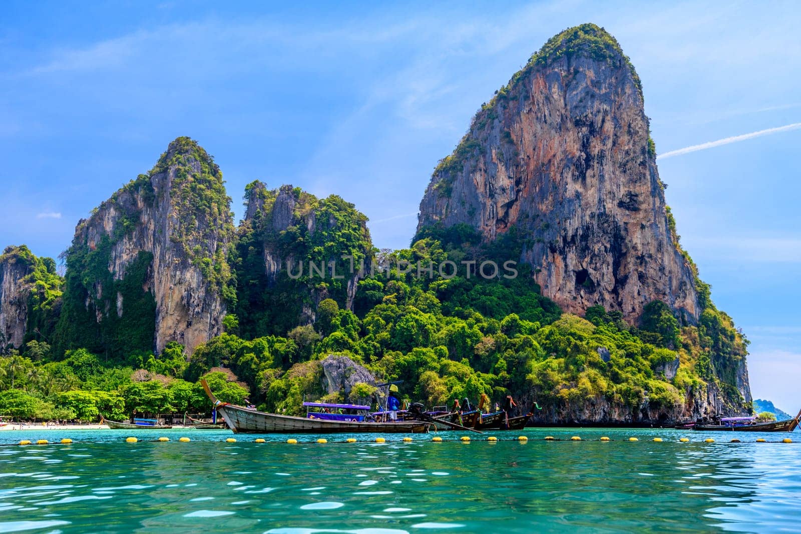 KRABI, THAILAND- MARCH 2018: Rocks and cliffs, water and tropical white sand beach, Railay beach west, Ao Nang, Krabi, Thailand by Eagle2308
