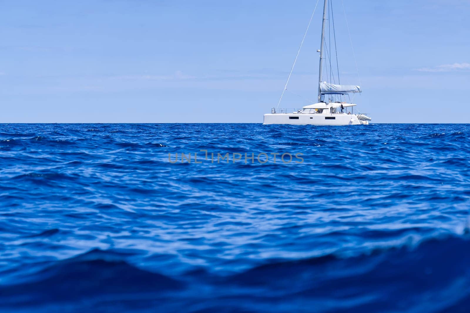 Yacht catamaran on the sea. Catamaran sailing on turquoise waters. Holiday or vacation at sea. Luxury yachts. summer