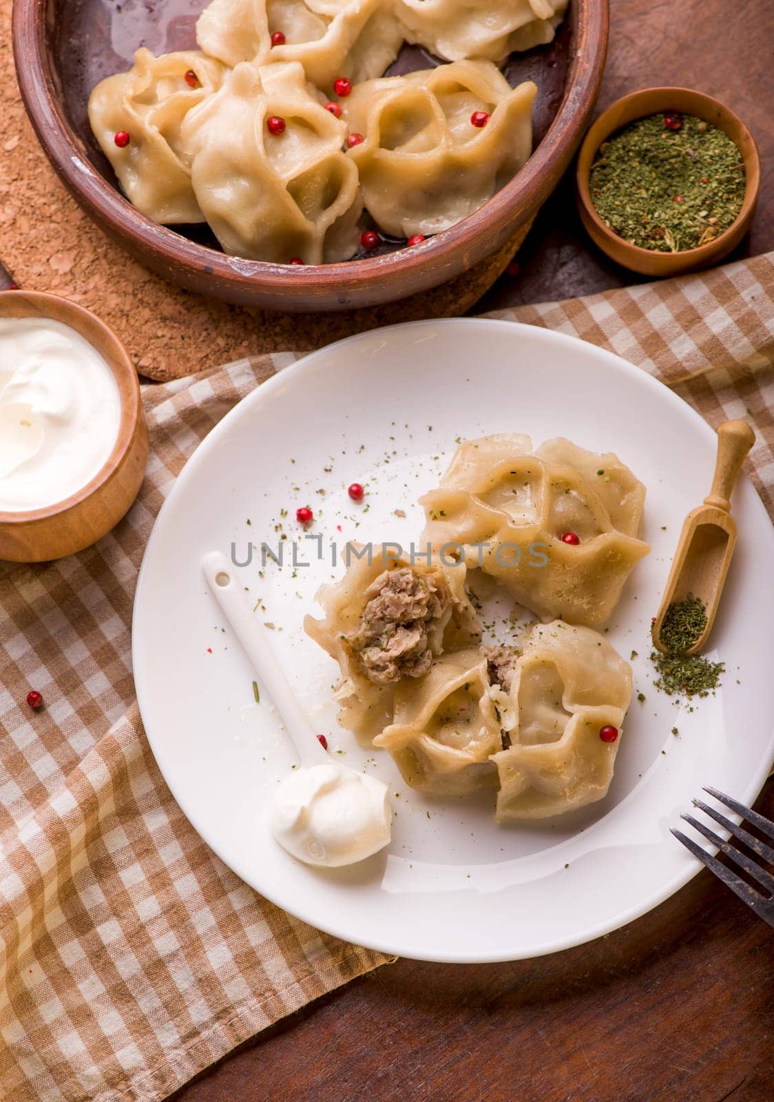 traditional Eastern dish manti or manty with beef in a dark by aprilphoto