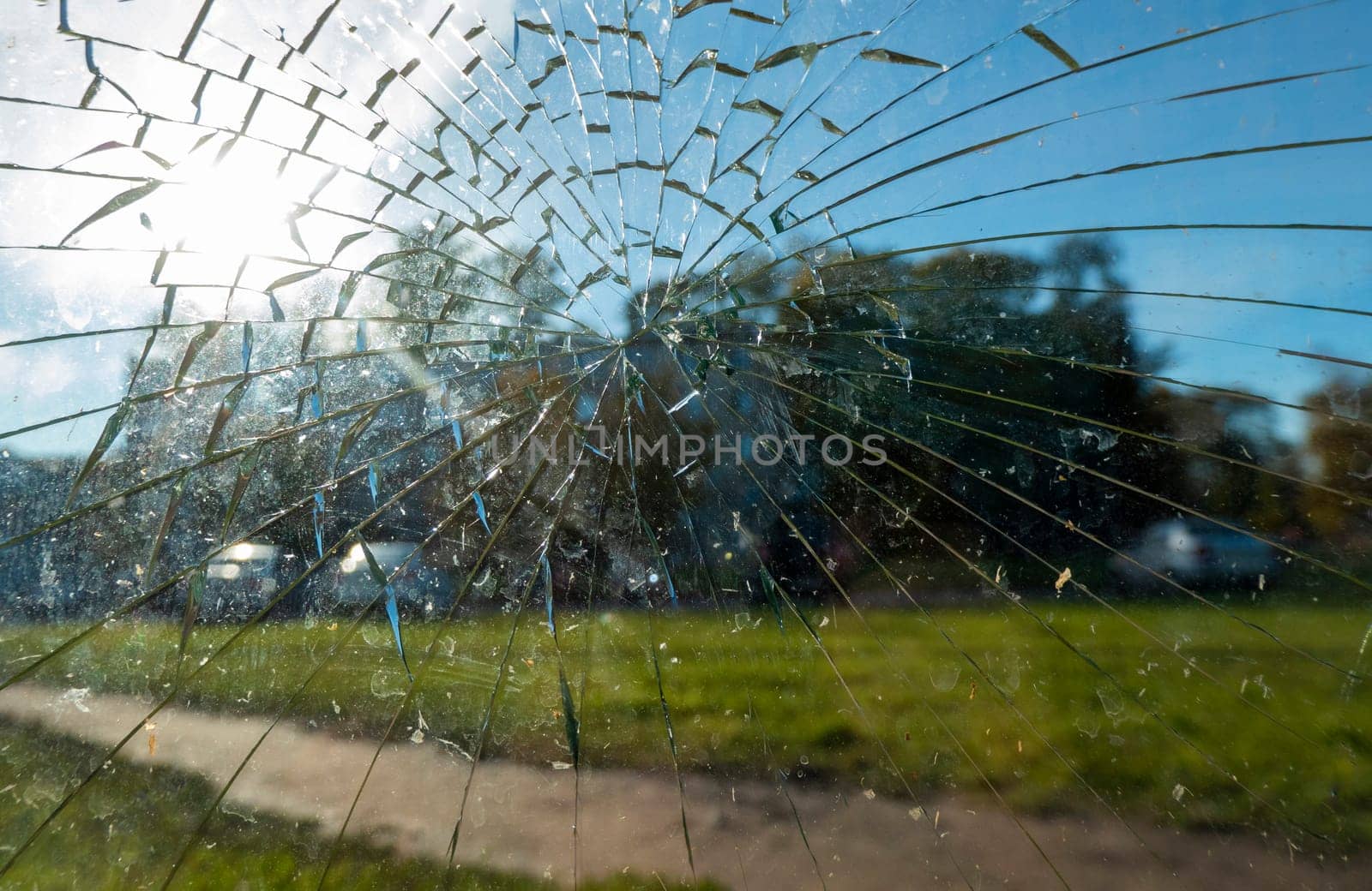 Broken glass at a street bus stop . High quality photo