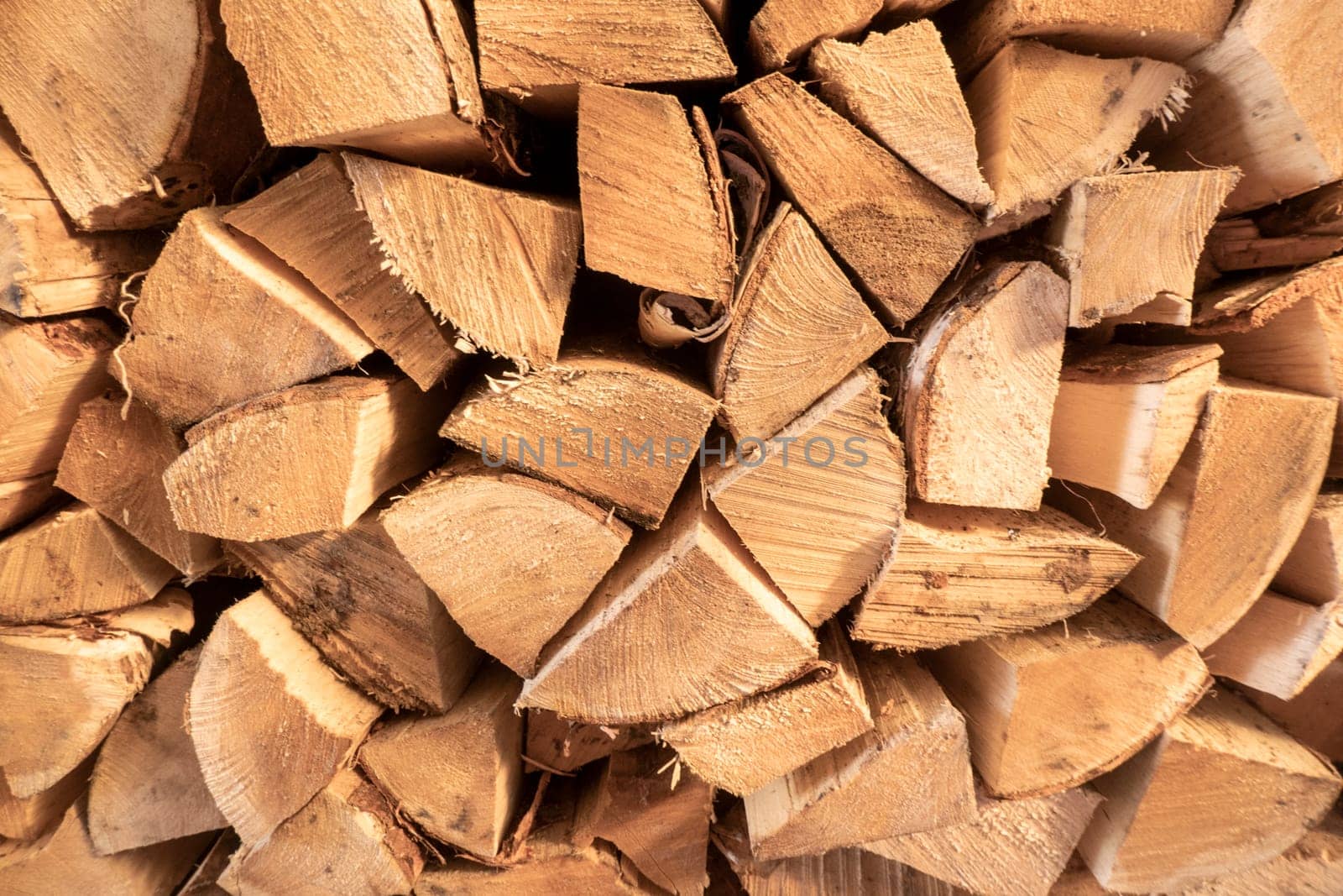 Log spruce trunks pile. Sawn trees from the forest. Logging timber wood industry. Cut trees along a road prepared for removal. High quality photo