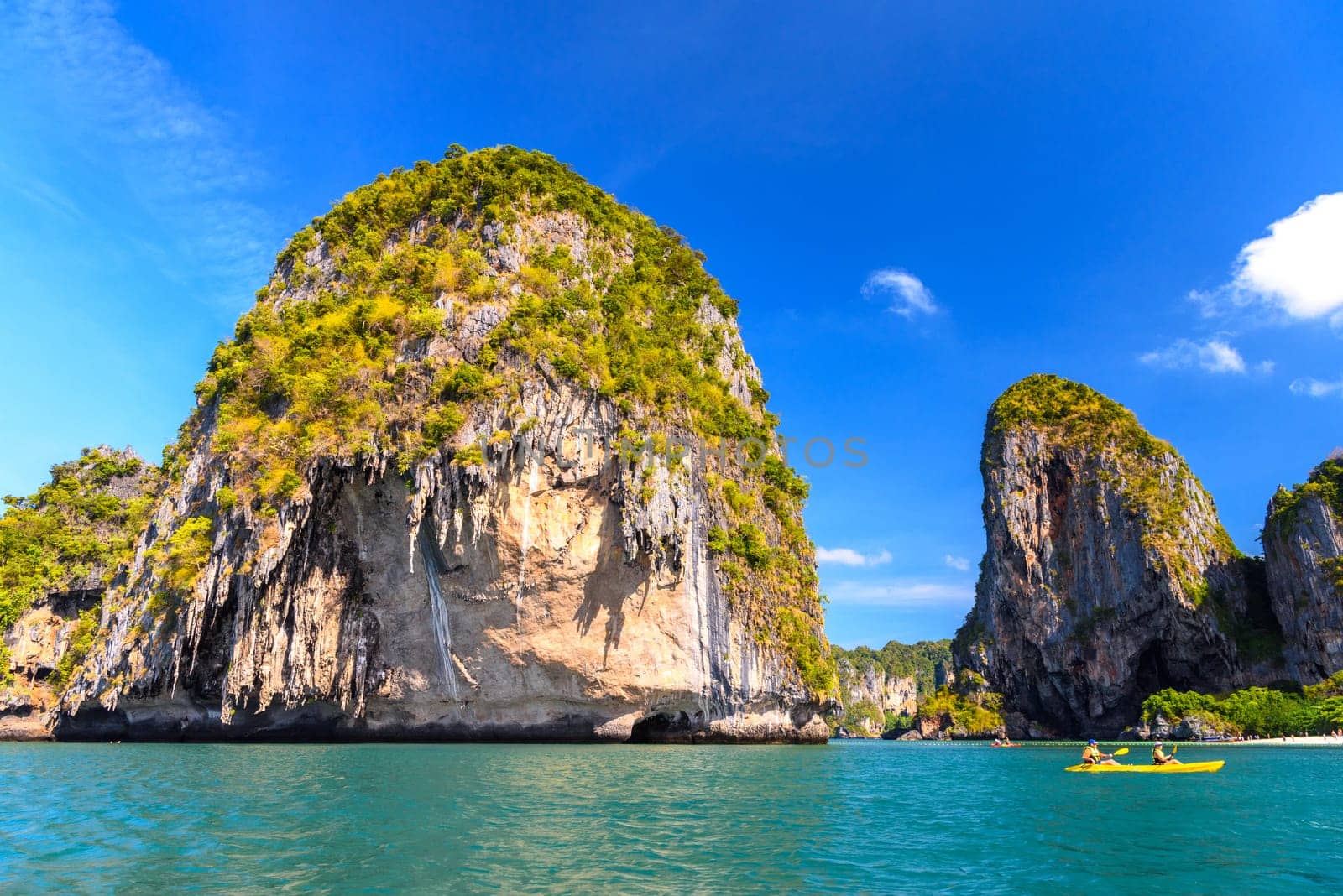 Huge cliff rocks in azure water, Ko Rang Nok, Ao Phra Nang Beach, Ao Nang, Krabi, Thailand.