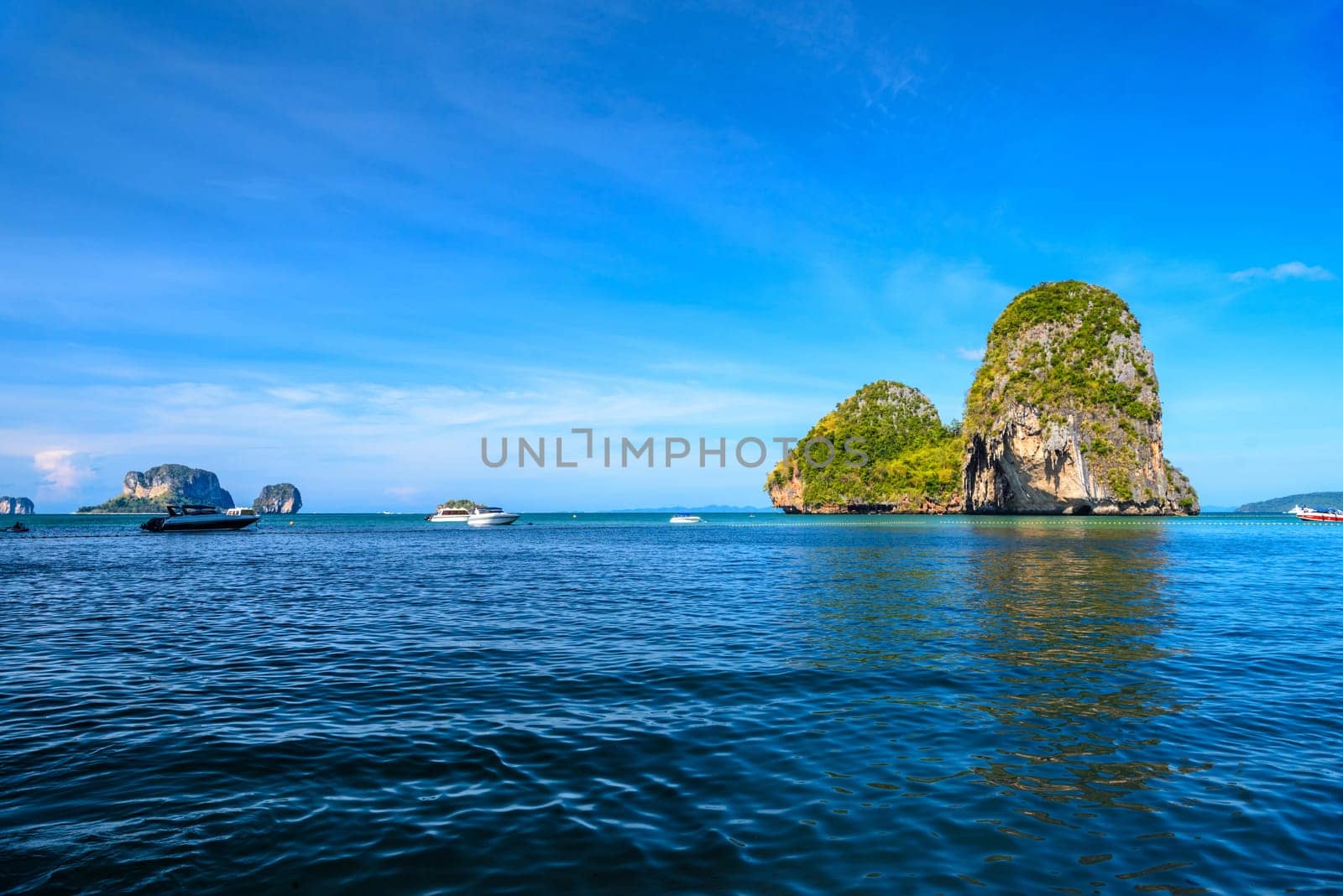 Huge cliff rock in azure water, Ko Rang Nok, Ao Phra Nang Beach, Ao Nang, Krabi, Thailand.