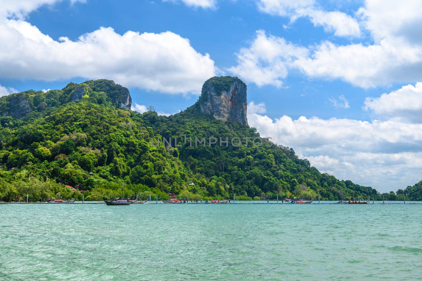 Rocks and cliffs covered with tropical trees, azure water on Ao Phra Nang Beach, Railay east Ao Nang, Krabi, Thailand.