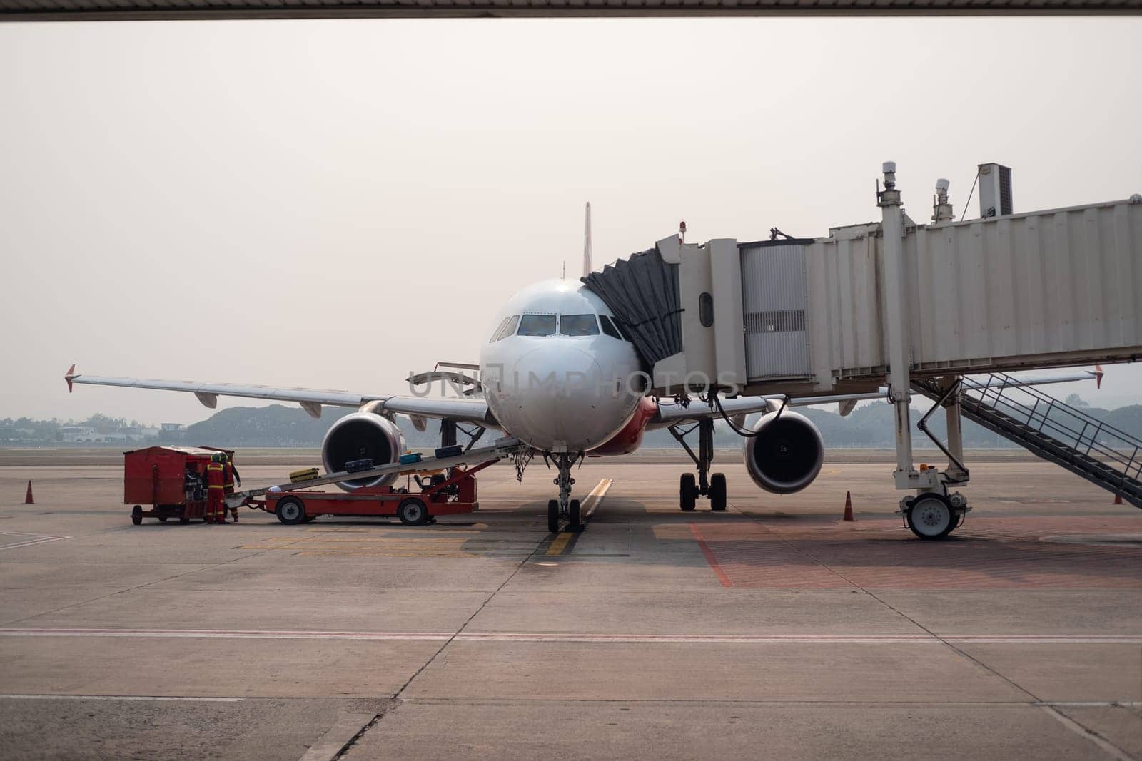 Aircraft parking at bay, Airbus320 parking, Aircraft connected with aero bridge, Aircraft operation. High quality photo