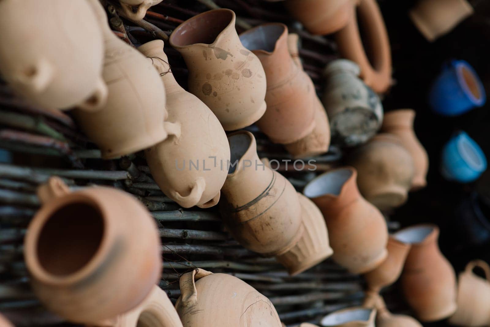 Ceramic clay terracotta jug, pot, vase, kitchen souvenirs in a handmade ceramics street store. by Zelenin