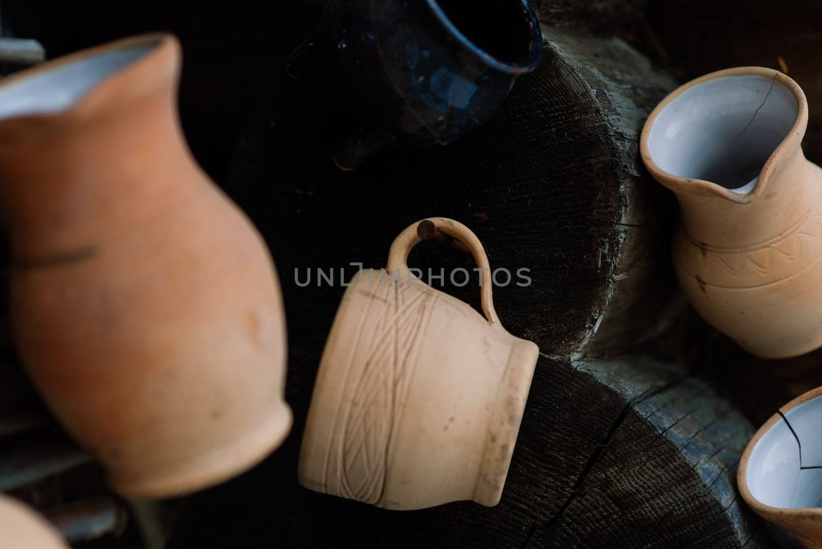 Ceramic clay terracotta jug, pot, vase, kitchen souvenirs in a handmade ceramics street store. by Zelenin