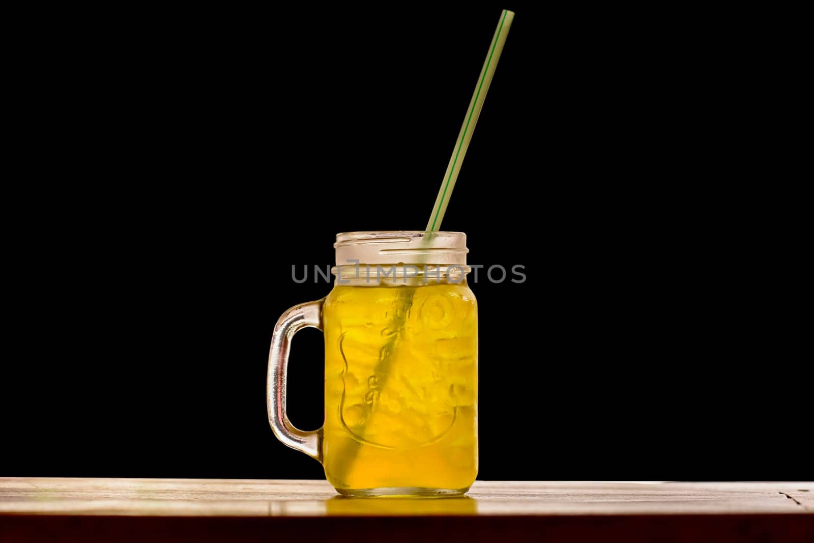 A soft drink isolated on a black background.