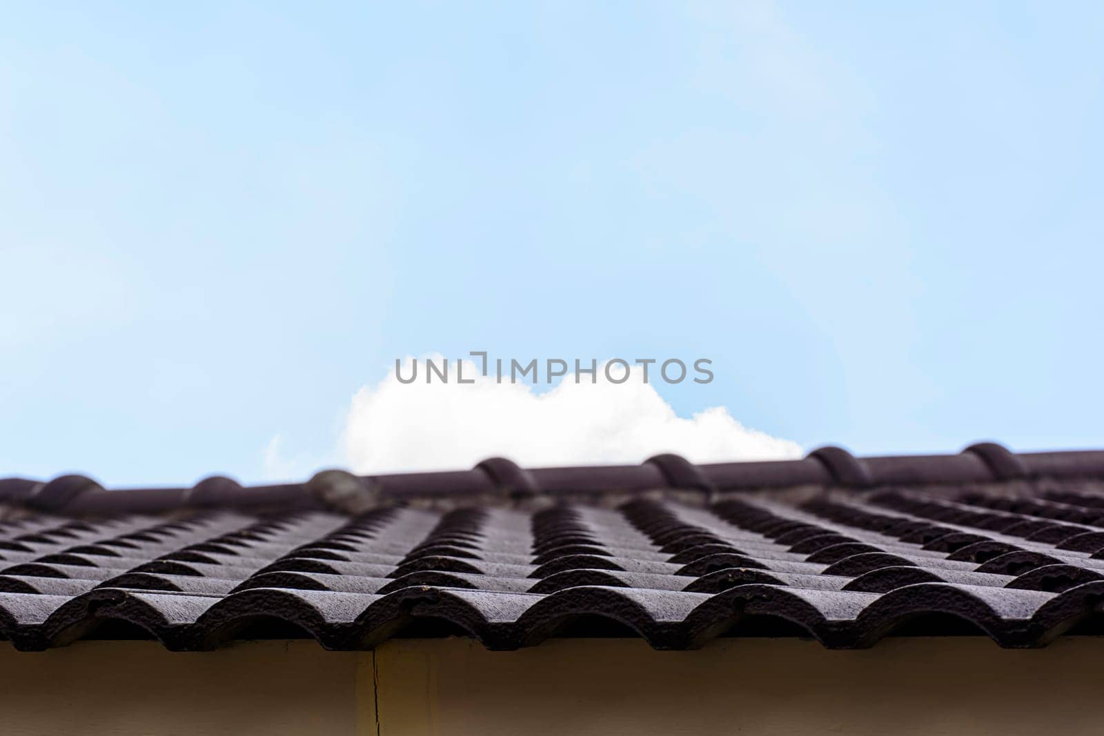 The roof tiles on blue sky background