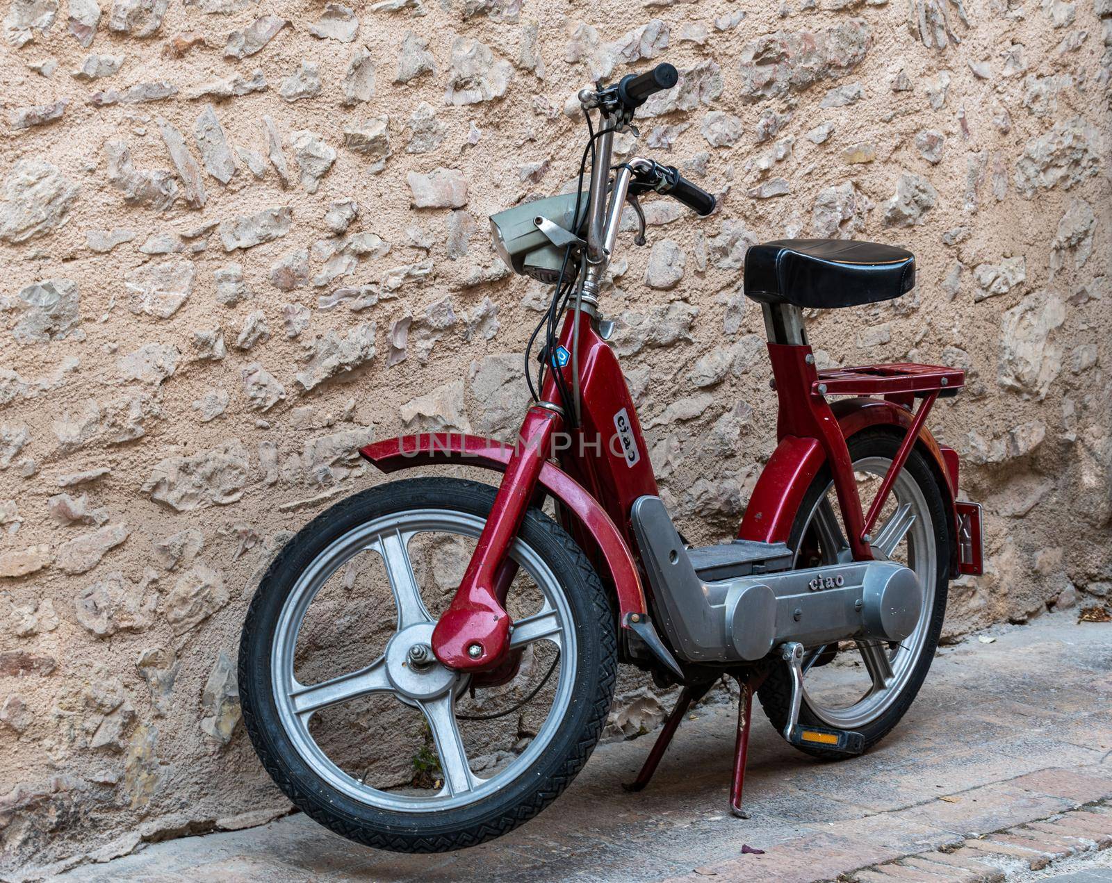 spello,italy august 21 2020:vintage piaggio scooter hi red color