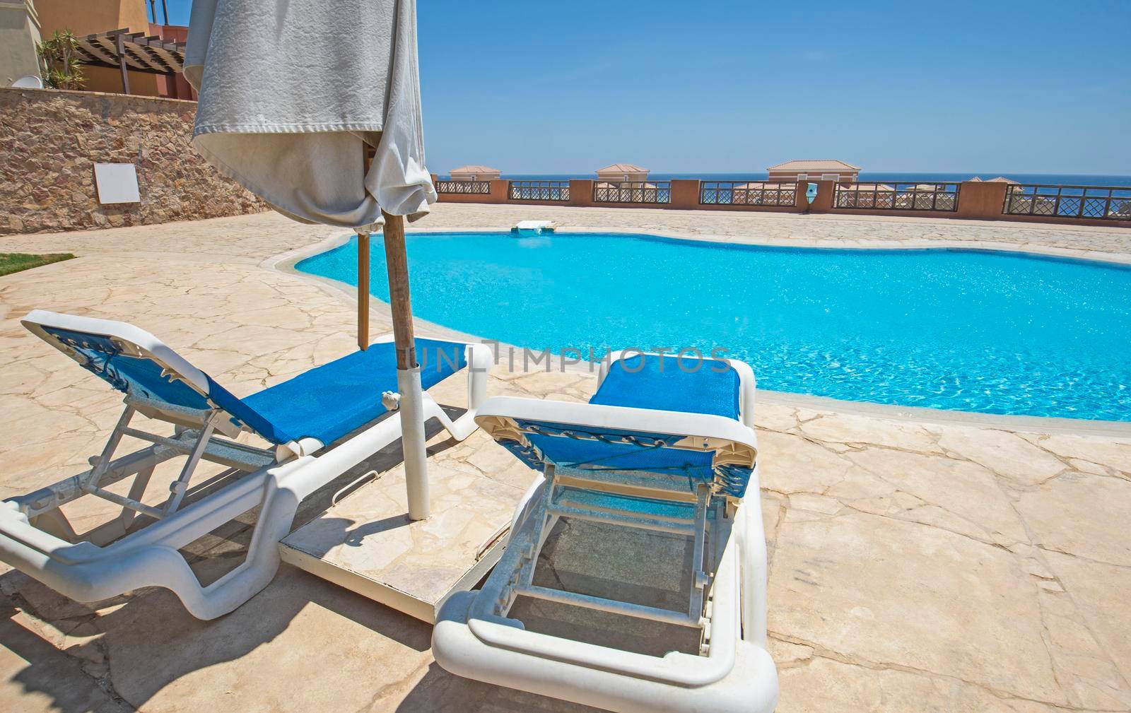 Outdoor swimming pool in a luxury tropical hotel resort by paulvinten