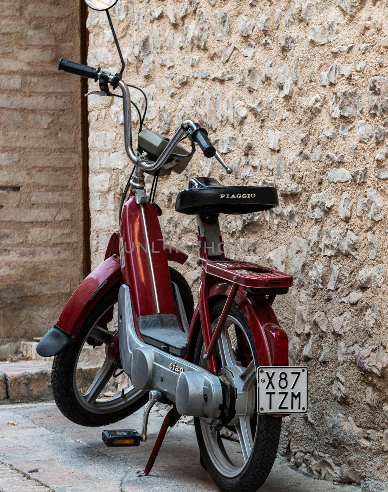 spello,italy august 21 2020:vintage piaggio scooter hi red color