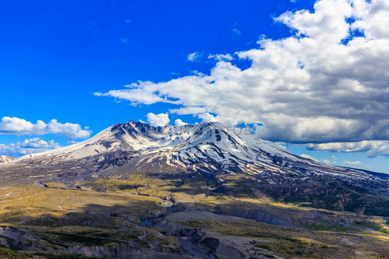 Snow on Mount St. Helens against Blue Sky and cloudscape