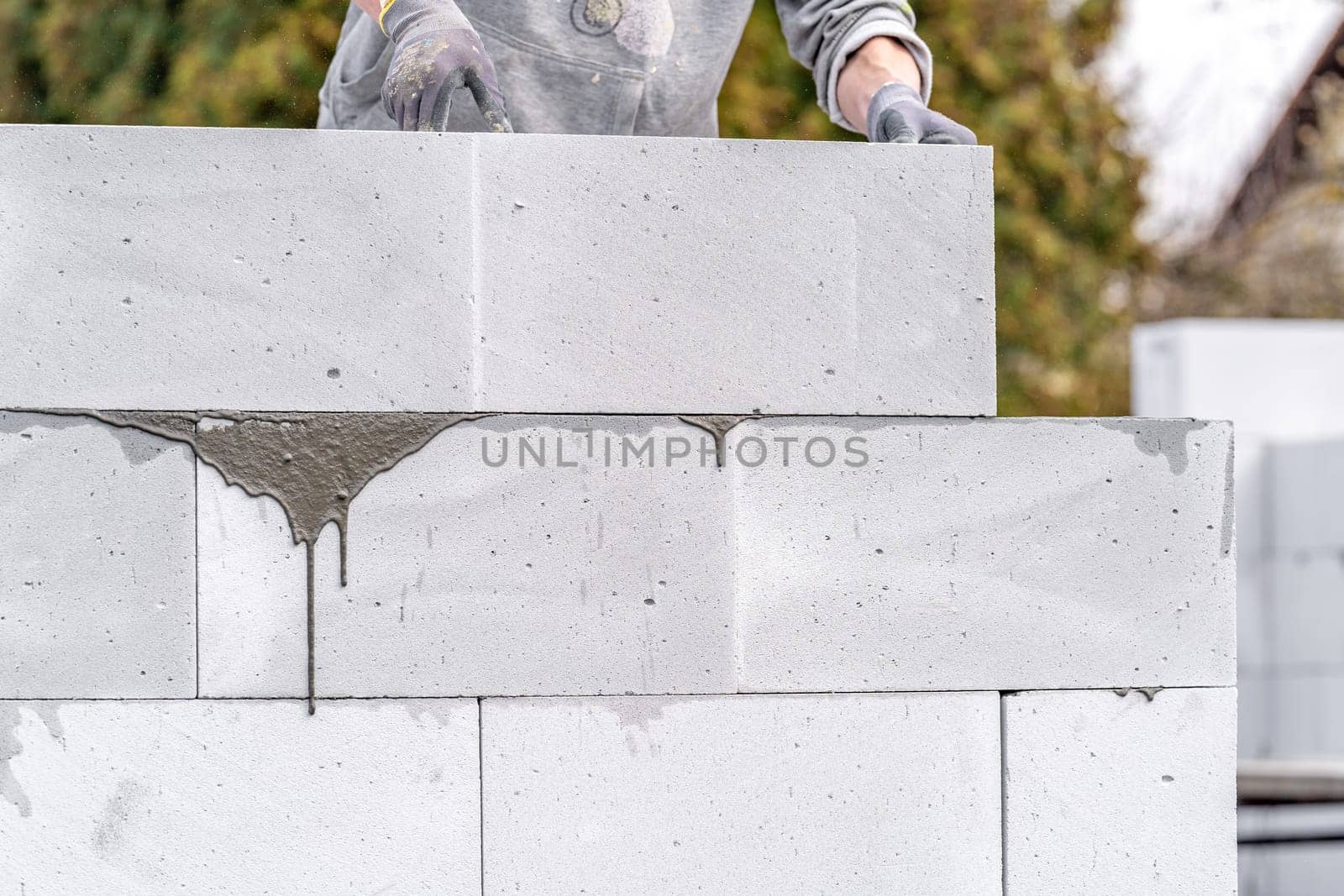 construction of a wall of a house made of aerated concrete blocks.