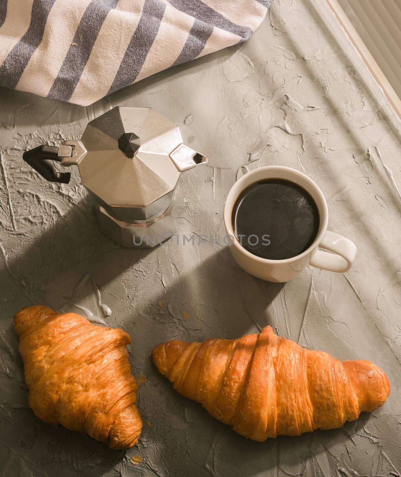 Breakfast with croissant and coffee and moka pot. Morning meal and breakfast concept. Top view. by Satura86