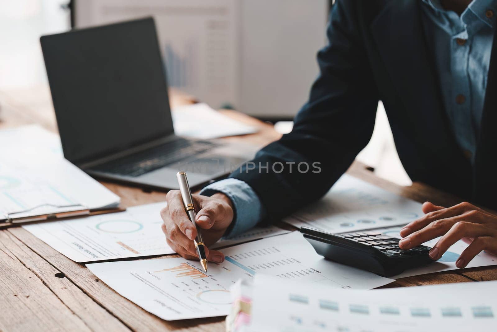 Close up Accountant man working with calculator and do document, tax, exchange, accounting and Financial advisor concept.