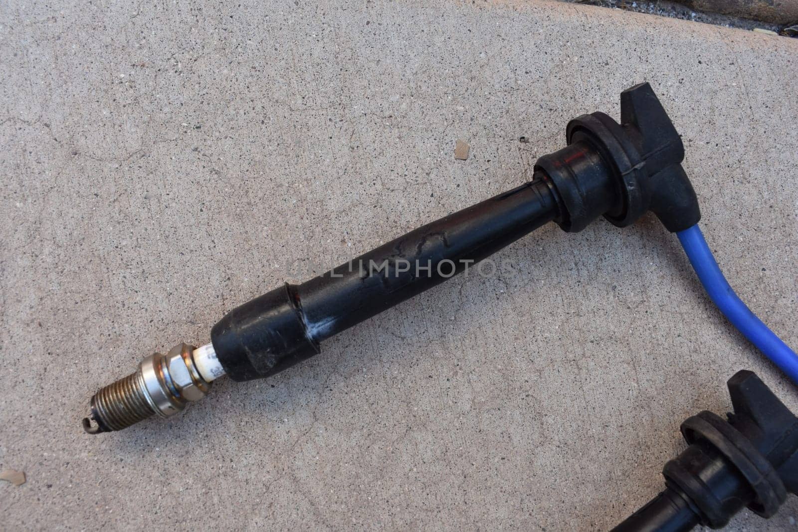 One Spark Plug Wire with Electrical Damage on Boot with Plug. High quality photo