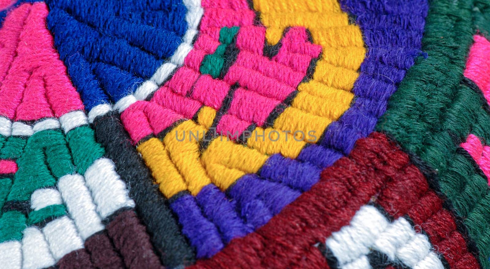 A closeup shot of national ornaments and patterns of Central Asia on a piece of cloth by A_Karim