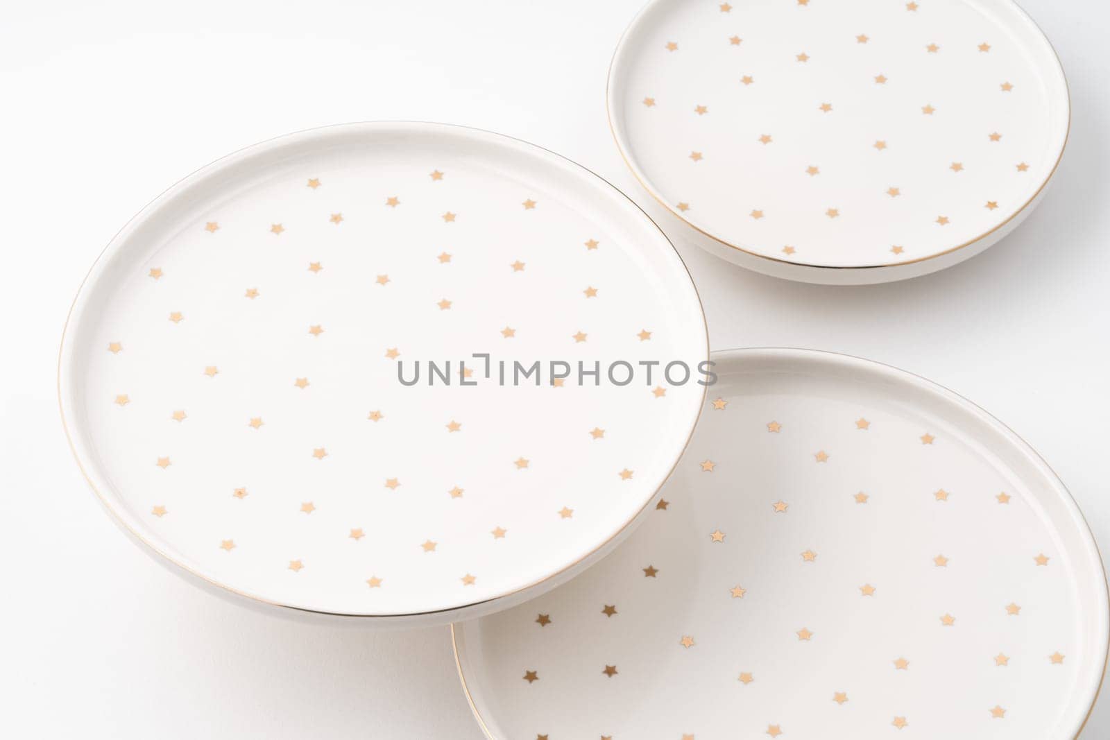 The ceramic plates isolated on white background by A_Karim