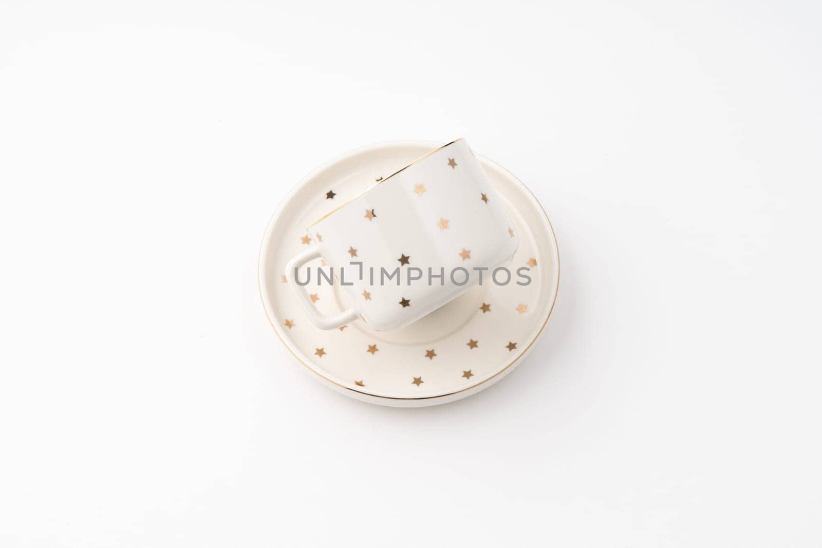 A ceramic cup with saucer isolated on white background by A_Karim