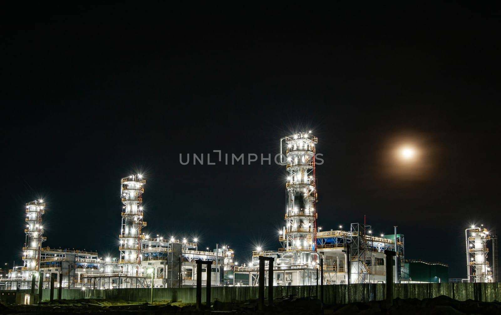 The oil refinery factory at night