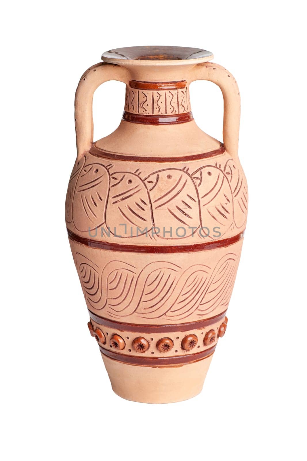 A vintage decorated ceramic jug isolated on a white background