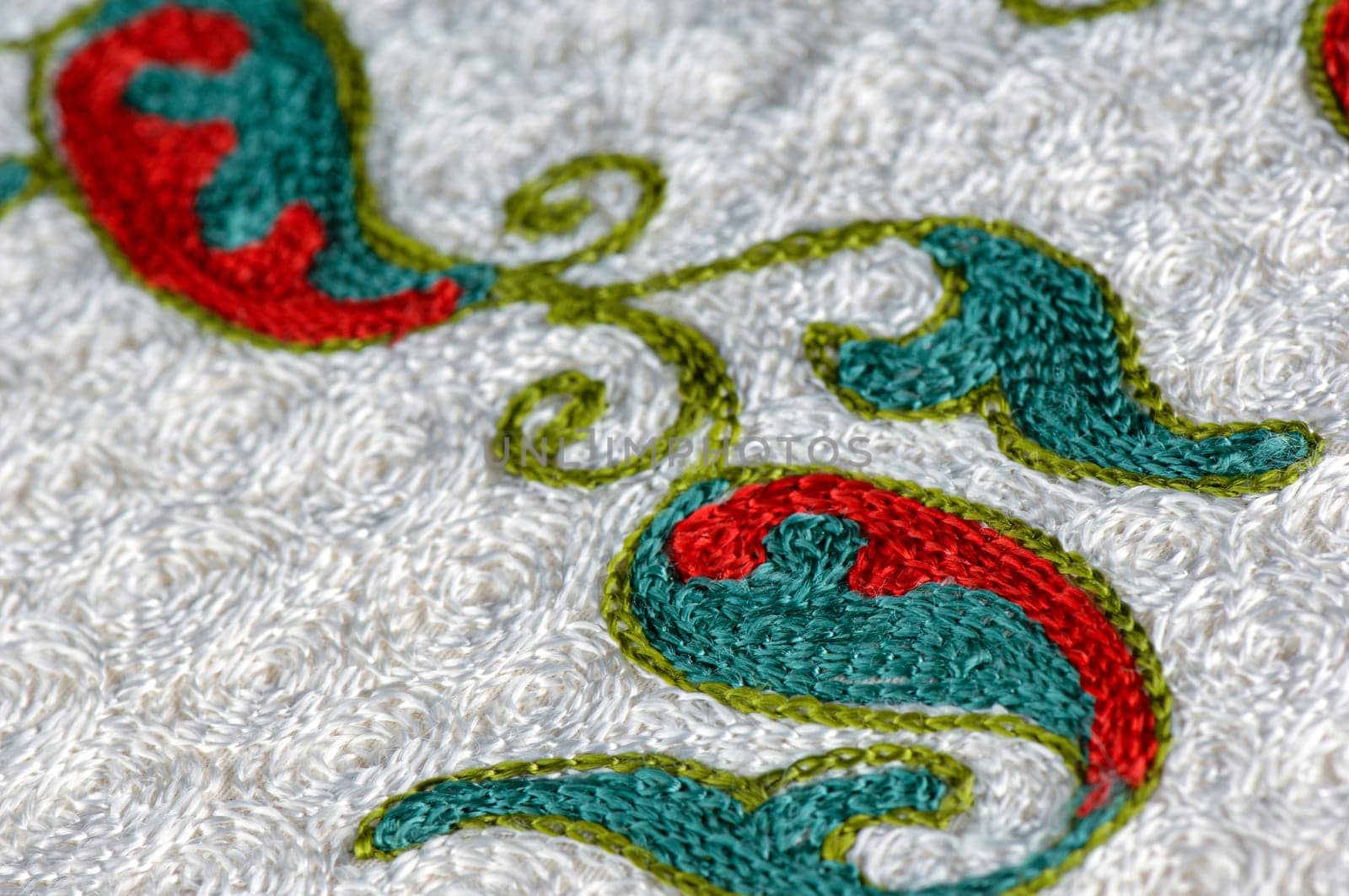 A closeup shot of national ornaments and patterns of Central Asia on a piece of fabric by A_Karim