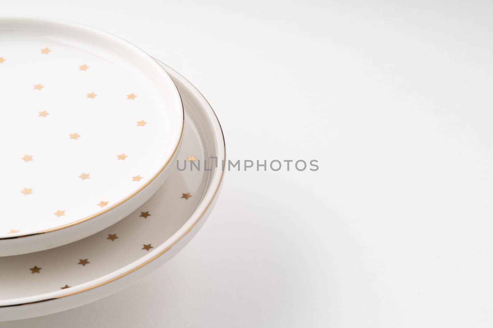 The ceramic plates isolated on white background by A_Karim