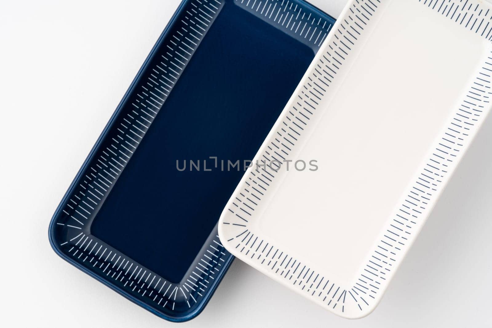 A set of blue and white luxury ceramic kitchen utensils on a white background