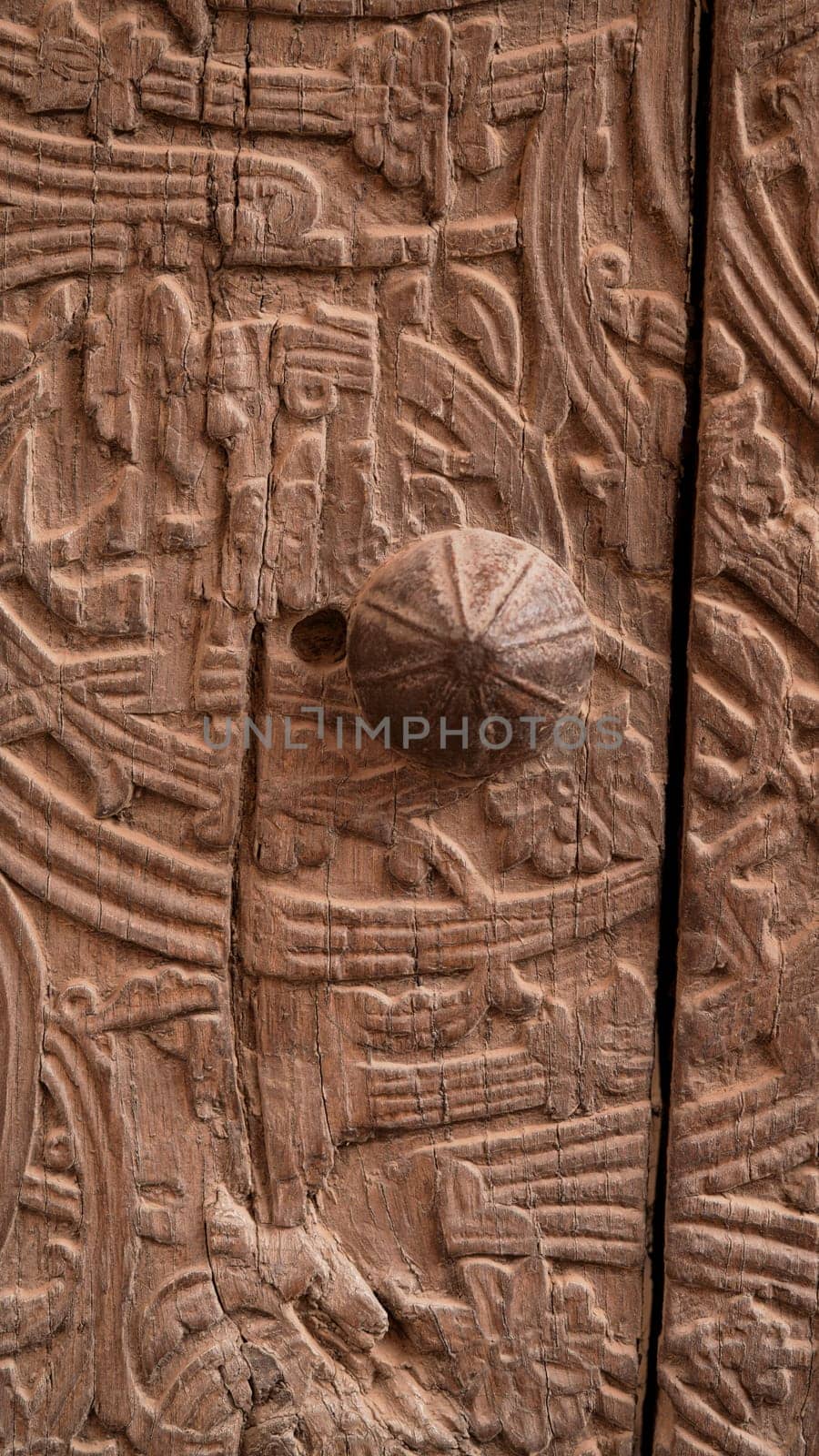 A closeup of ornate metal door handles on an ancient fortress in Central Asia. Uzbekistan, Bukhara