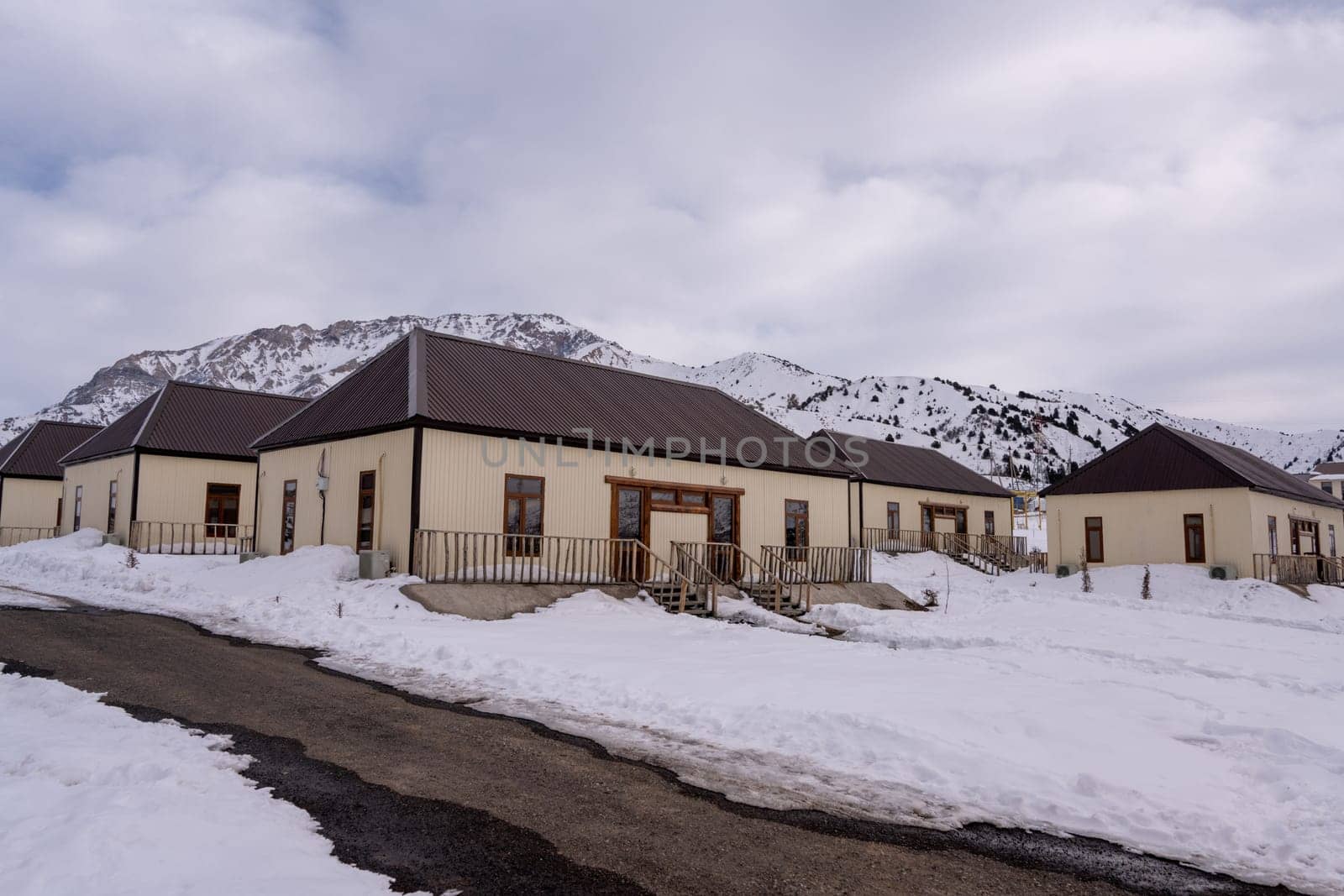 The cottages surrounded by snow in a recreation area in the mountains by A_Karim