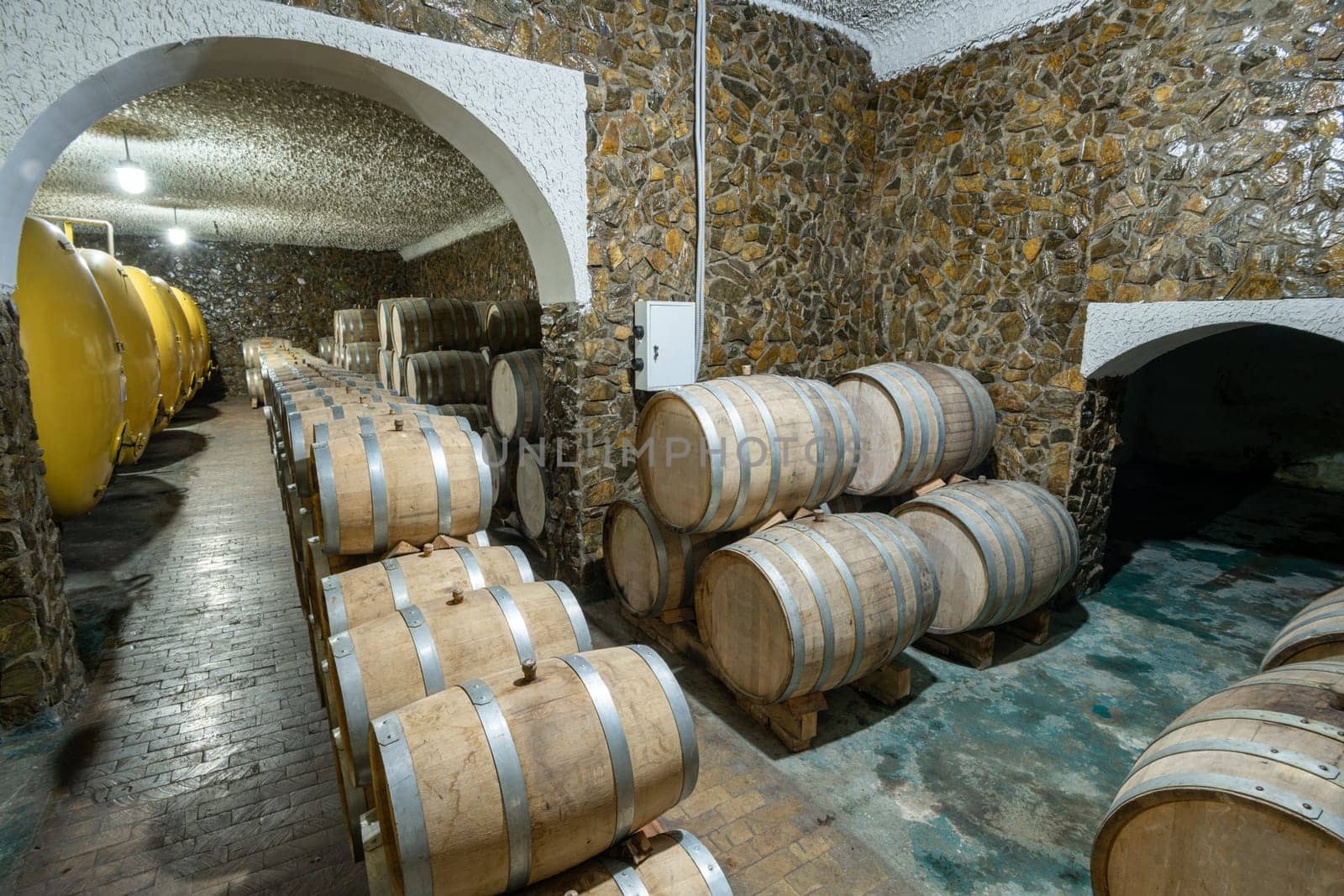 The wooden wine barrels in a wine factory