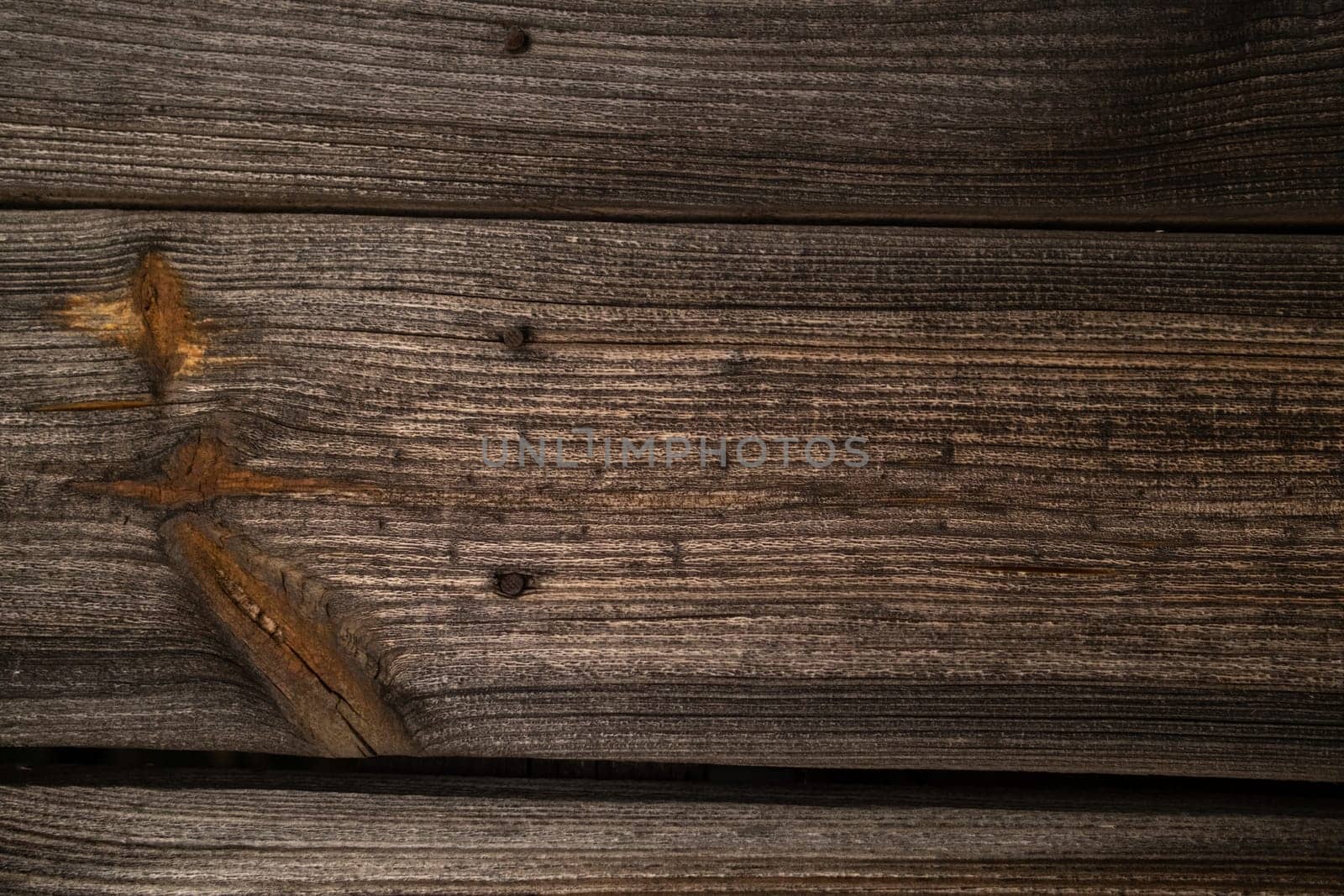 Wood texture natural background. Dark brown scratched wooden cutting board