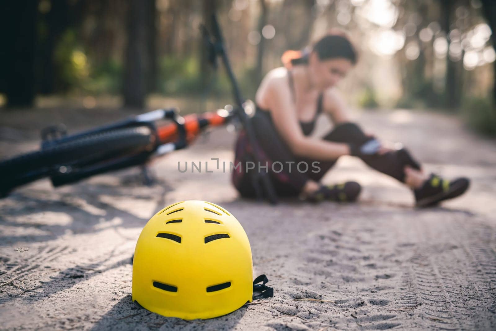 Protective helmet on forest road, bike accident