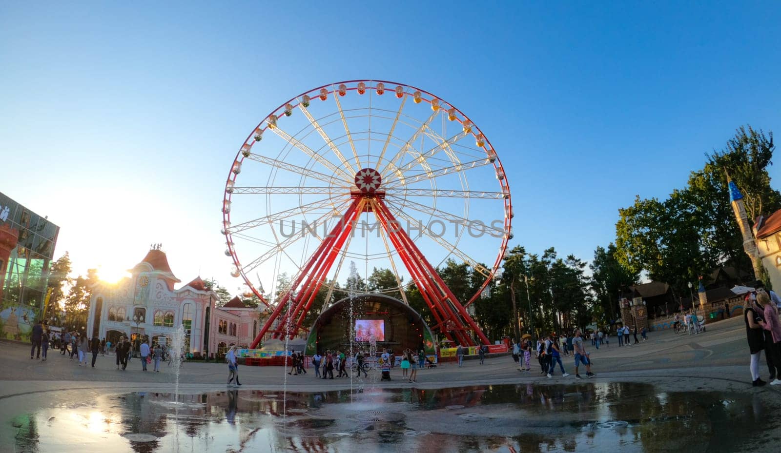 Kharkiv, Ukraine - 14 October 2020: Central square of Gorky Park with fountain and Ferris Wheel in Kharkiv, Ukraine