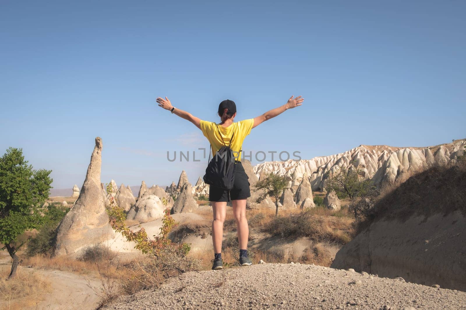 Tourist standing on turkish mountains background by GekaSkr