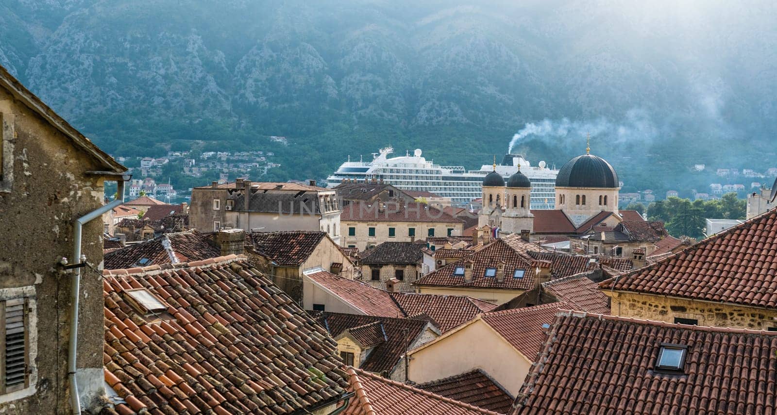 Kotor, Montenegro buildings with old orange roofs. View on ancient adriatic city from above