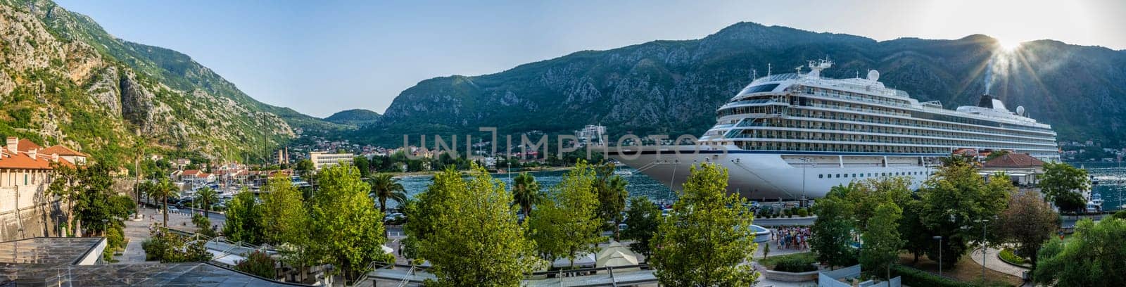 Kotor, Montenegro beautiful panoramic view on bay with crouise ship. Ancient adriatic city and mountains