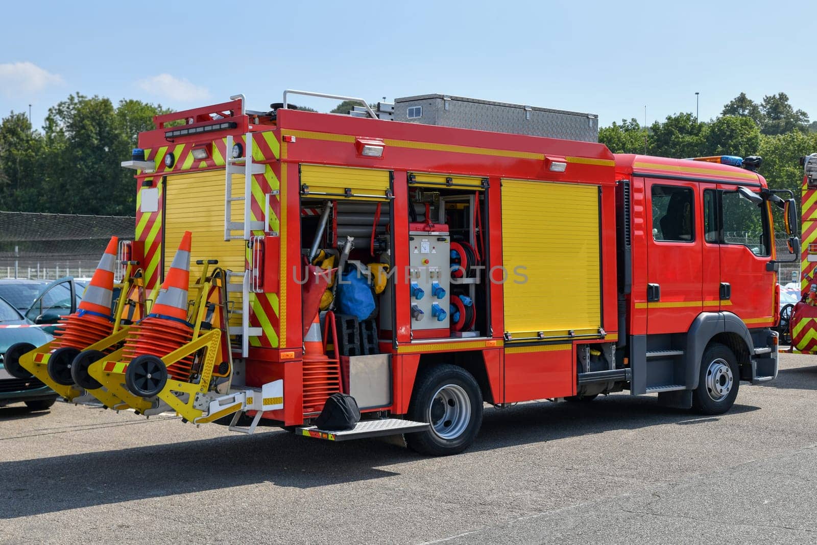 Big red fire engine with fire equipment