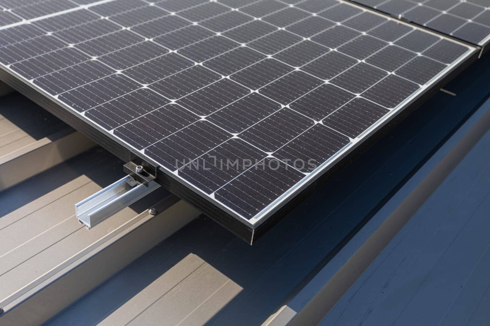 Mounted on the roof of the building solar panels for trapezoidal sheet metal. by fotodrobik