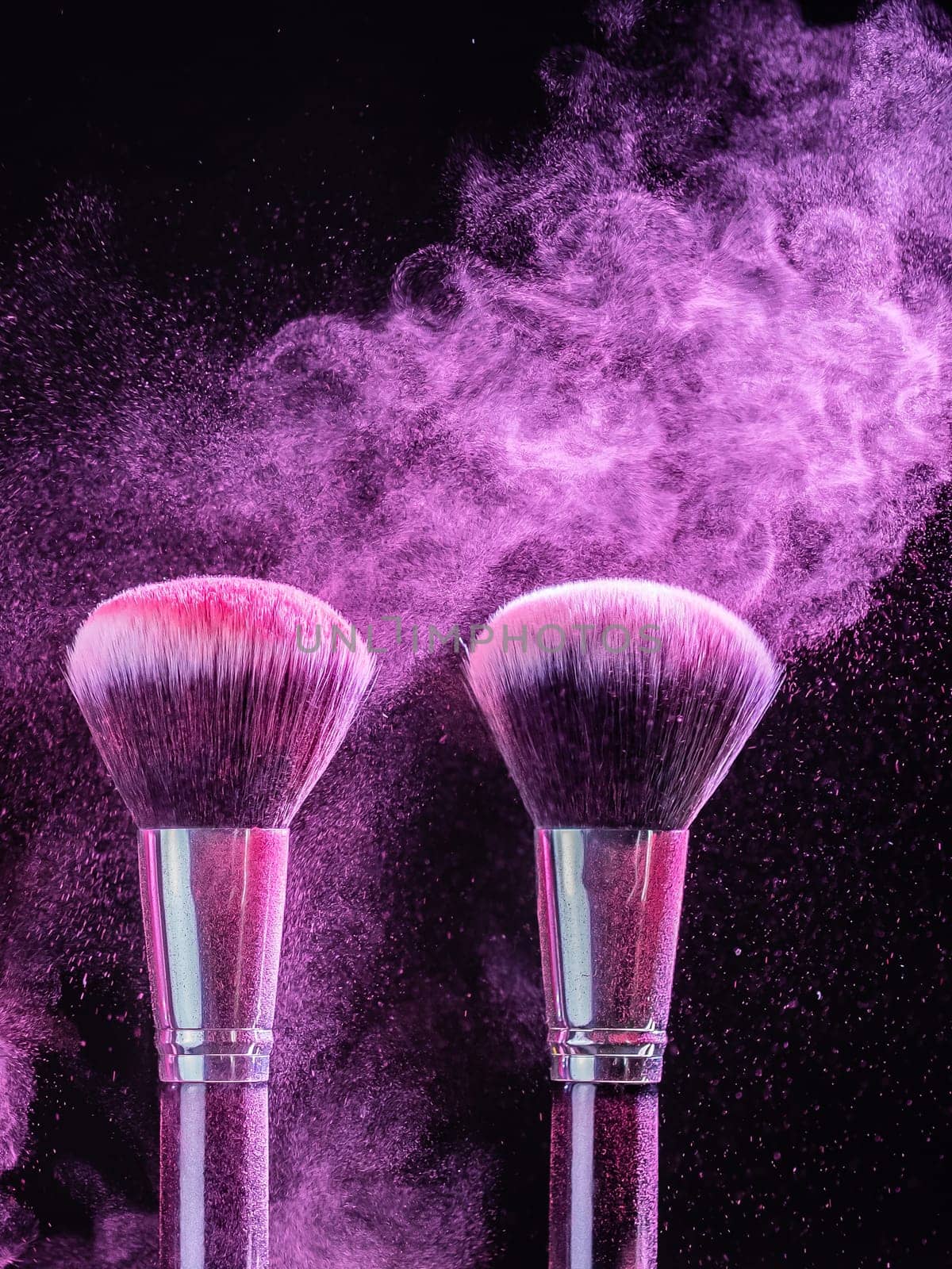 Cosmetics brush and explosion colorful makeup powder background - beauty make-up product and mineral cosmetic concept by Satura86