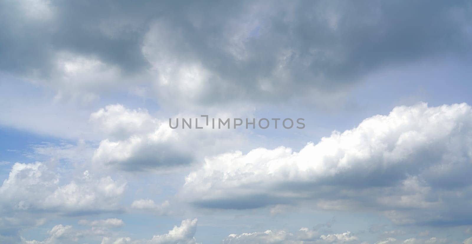 Overcast sky. Dramatic gray sky and dark clouds before rain in rainy season. Cloudy and moody sky. Storm sky. Gloomy and moody background. Overcast clouds. Sad, lonely, and death abstract background. by Fahroni