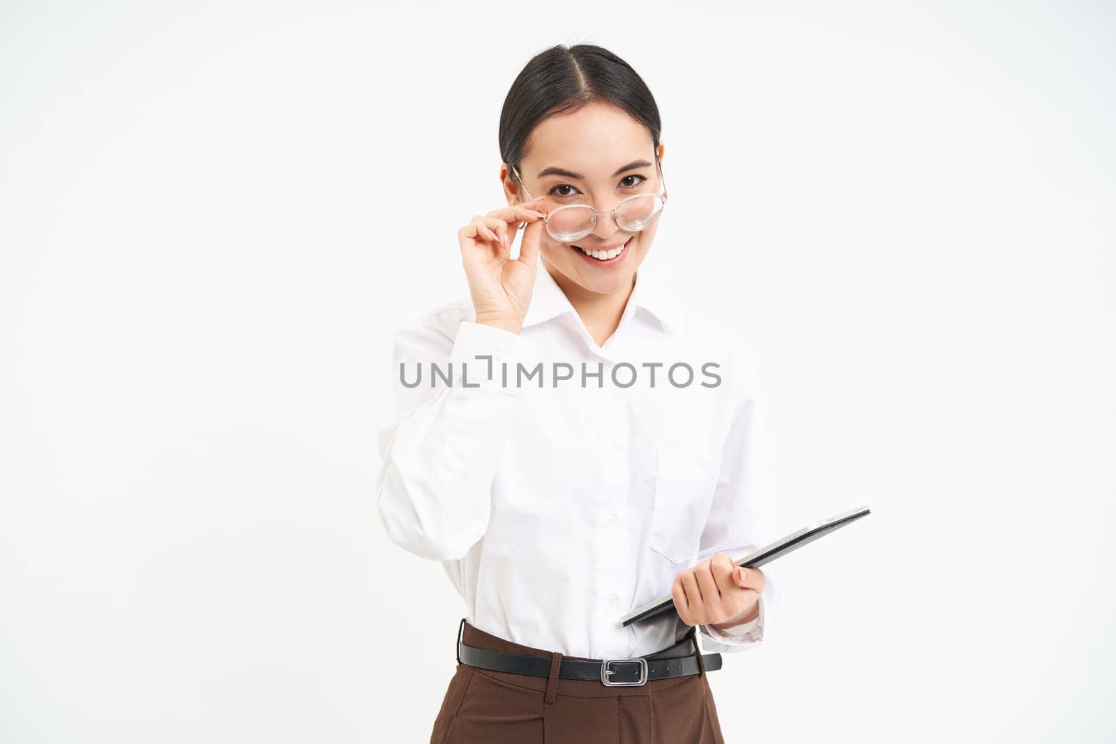 Beautiful asian woman, entrepreneur with digital tablet, working on business project, leading meeting and looking at notes on device, white background by Benzoix