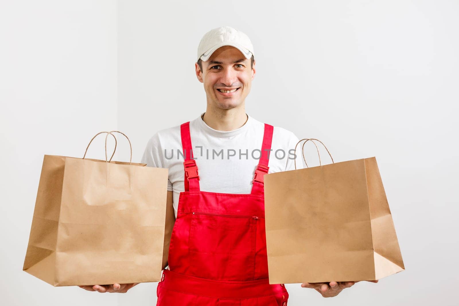 paper containers for takeaway food. Delivery man is carrying.