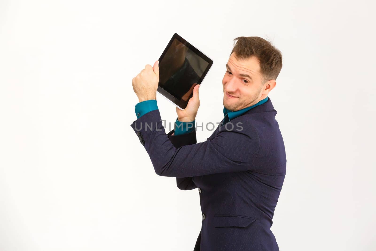 Mad man with digital tablet on white background