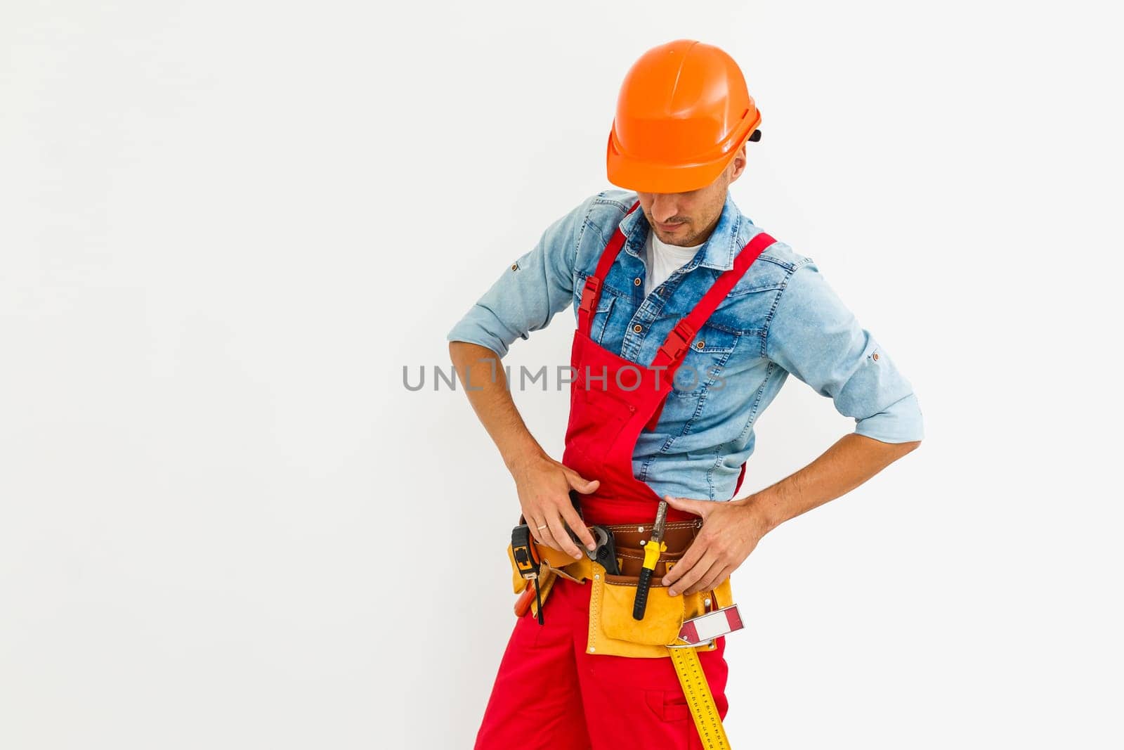 profession, construction and building - happy smiling male worker or builder in helmet over white background. by Andelov13